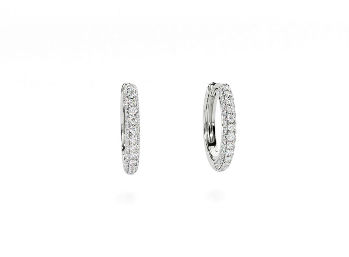 Elegant and radiant, the Selene Hoops are designed to turn heads without shouting for attention. Featuring three rows of pavé-set diamonds, they shimmer beautifully from every angle. Pair them with the Selene solitaire for a look that’s effortlessly striking.