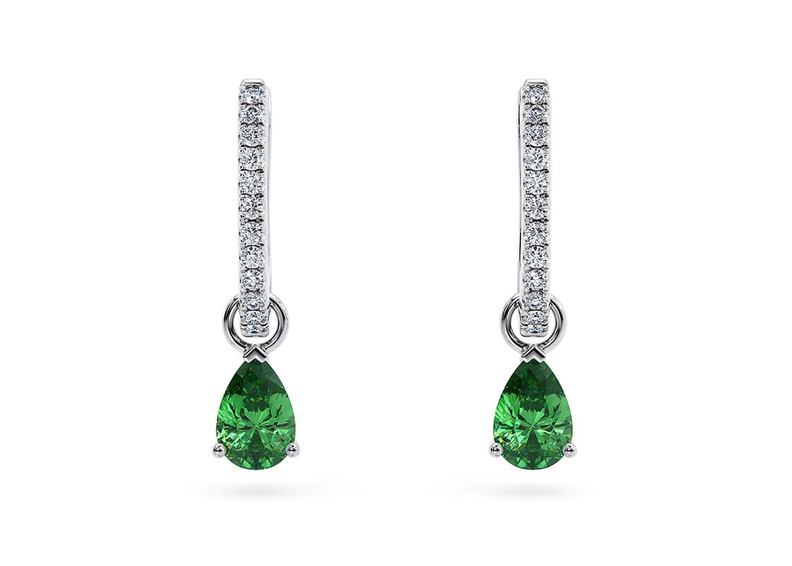 Two pear-shaped tsavorites bring a vibrant pop of green to these refined, versatile earrings. Their clever design lets you switch between full drops or just the diamond hoops—perfect for both statement days and minimalist moods.