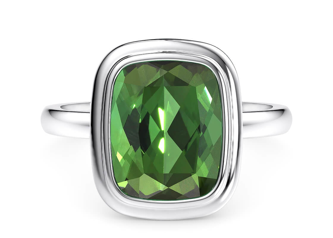 Designed to highlight the vibrant colour of the gemstone, the Verdelle Cushion showcases a stunning green tourmaline at its heart. Encased in a double-stepped bezel setting, this piece offers a crisp, defined look while maintaining a classic and timeless elegance.