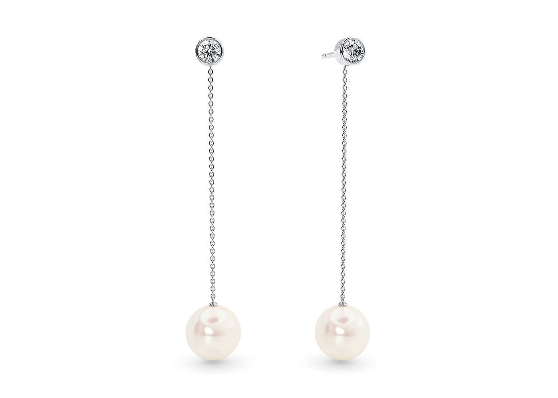 These elegant earrings combine the gentle movement of two matching Akoya pearls with a subtle sparkle of diamonds. When you want a simpler look, the diamond studs can be worn alone, offering versatile style for any occasion.