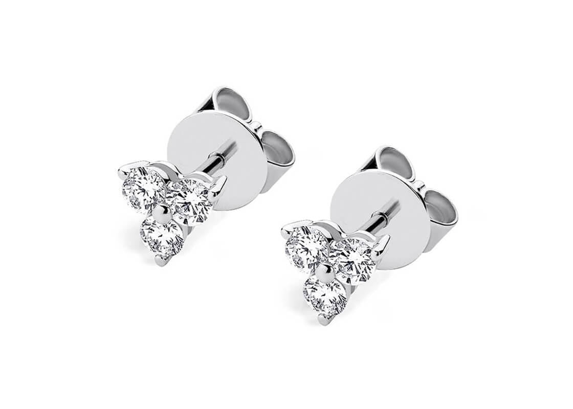 Delicate and radiant, the Iris Trio earrings feature two perfectly matched sets of three diamonds - offering just the right amount of sparkle for a subtle, polished finish. Ideal for adding a hint of elegance to any look, day or night.