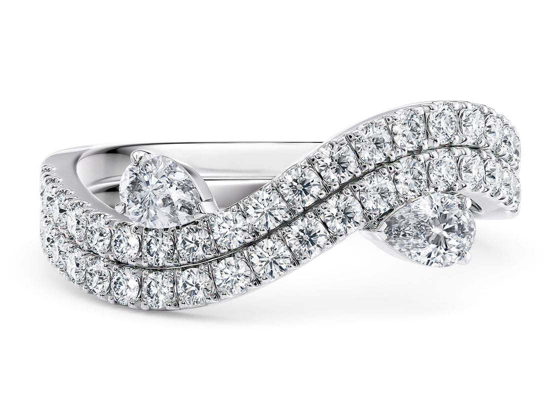 A beautiful symbol of two souls intertwined, Affinity features two pear-shaped diamonds that can be worn alone or together, creating a sparkling harmony that dances with every movement.