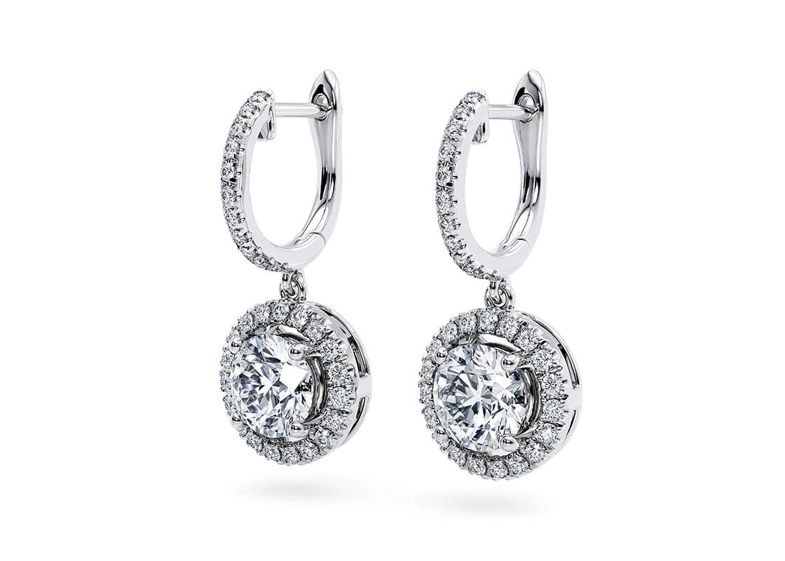 Refined and radiant, the Aurelia Halo earrings are crafted with intricate detailing to enhance their timeless charm. A delicate diamond halo surrounds your chosen stones, amplifying their brilliance with a captivating shimmer.
