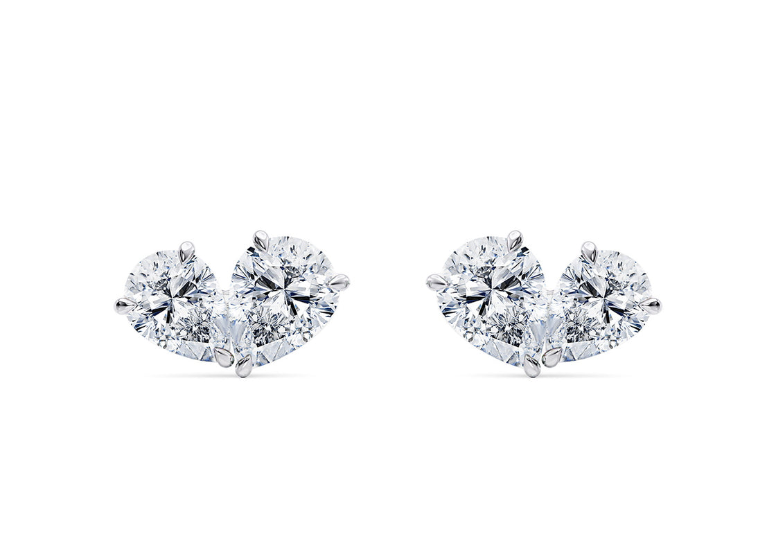 Delicate and radiant, these studs feature two pear-shaped diamonds gently coming together in a graceful, tender embrace — a timeless symbol of connection and elegance.
