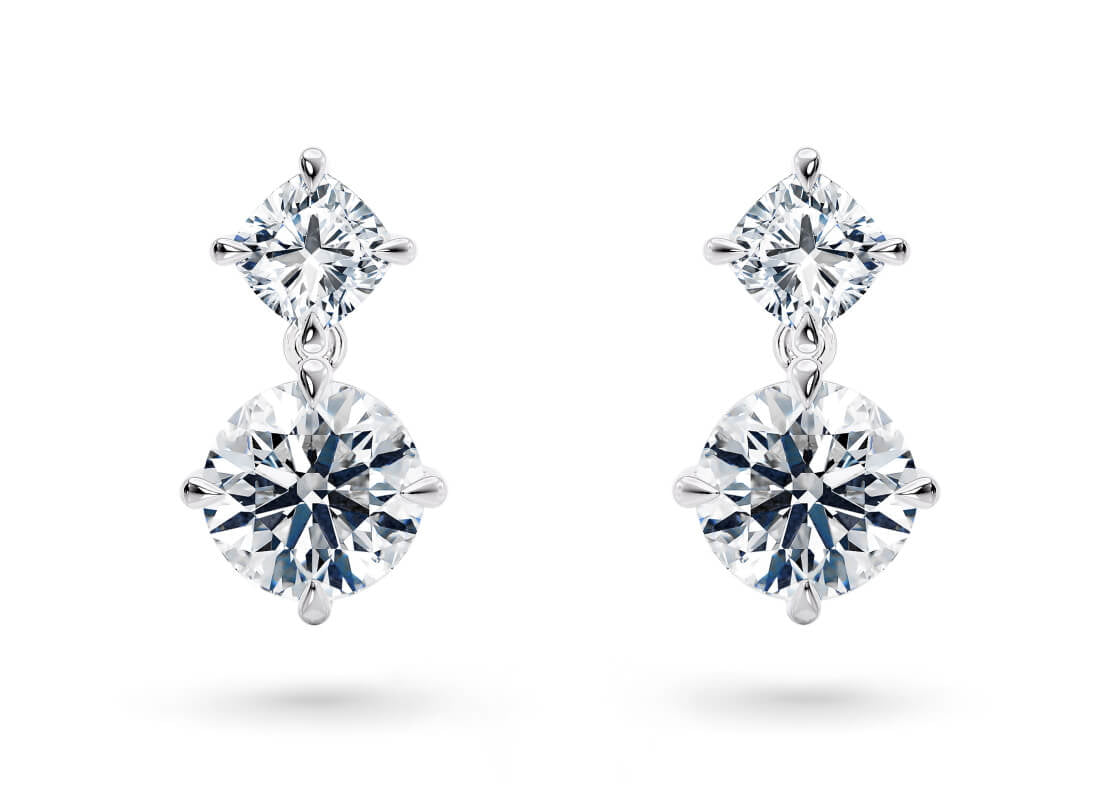 Your chosen diamonds hang gracefully from two compass-set studs, designed to capture the brilliance of the brightest stars in the night sky.
