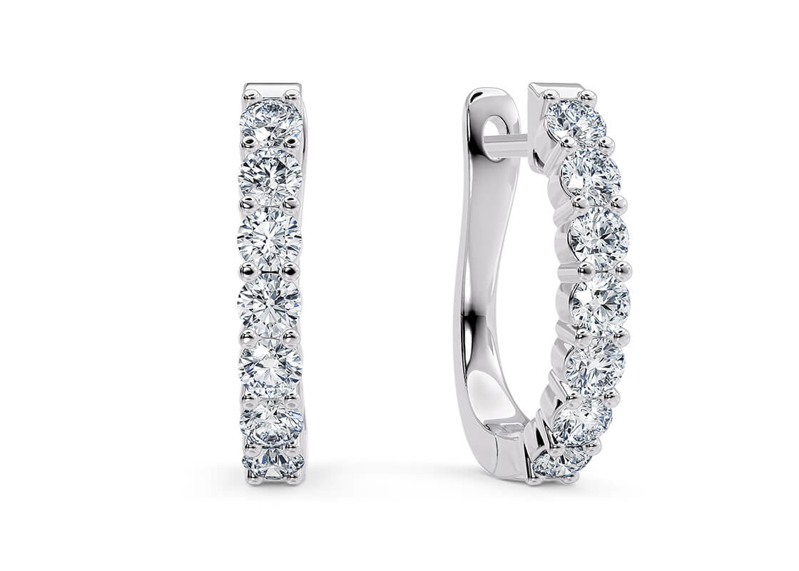 Graceful and effortlessly stylish, the Élan Hoops strike the perfect balance between subtle sparkle and timeless elegance. Whether you're dressing up or keeping it casual, these earrings add a refined finishing touch to your everyday look.
