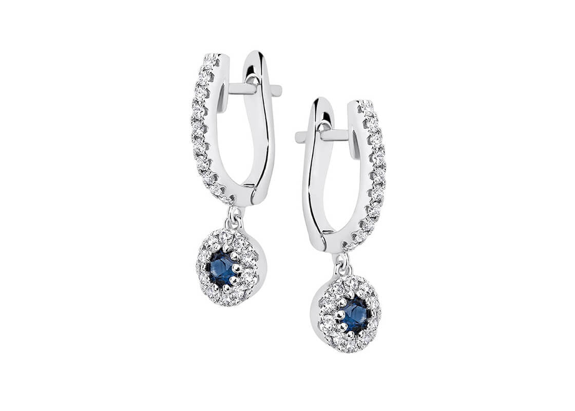 Timeless and refined, the Solara Drops feature two slender drops set with your choice of round brilliant diamonds or sapphires. Their graceful design radiates a soft, elegant glow — perfect for adding a hint of sophistication to any look.