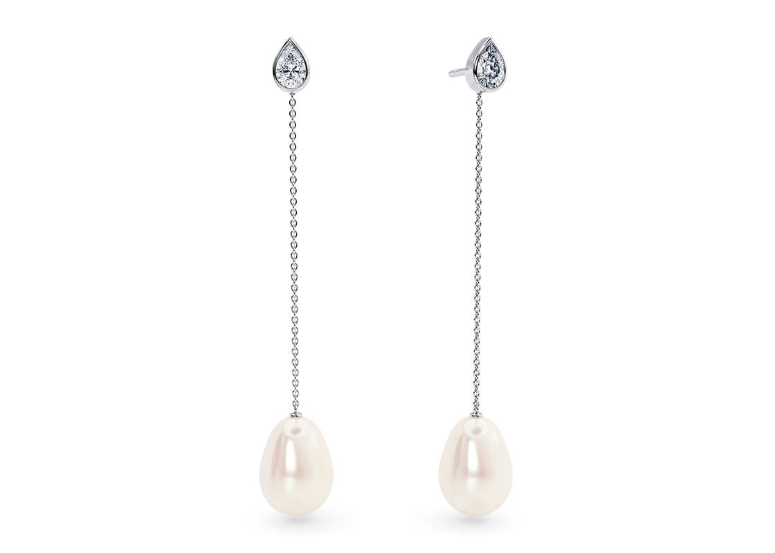 Gracefully combining gentle movement with subtle diamond sparkle, the Selene Drops showcase two matching freshwater pearls. When you prefer a simpler look, wear the delicate diamond studs on their own for a refined touch.