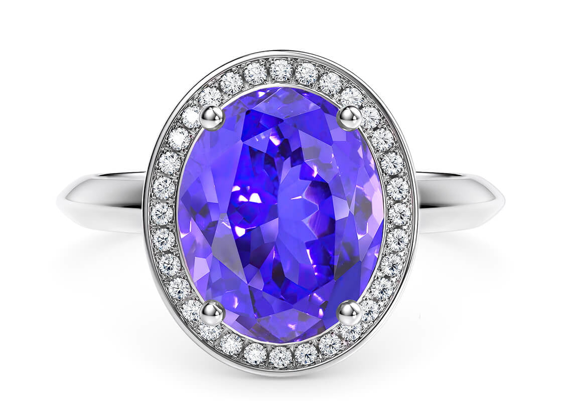 Set with a large centre pink tourmaline or purple tanzanite, the Kaleida Cocktail Ring is further enhanced through a delicate diamond halo, which also serves to protect the centre stone.