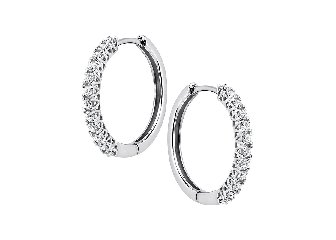 Delicate yet dazzling, the Elara hoops add just the right touch of sparkle. Featuring shimmering diamonds set in overlapping claws, these earrings bring understated elegance to any look - perfect for both everyday wear and special moments.