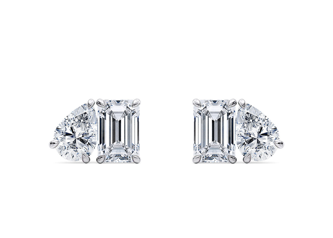 Bright and graceful, these studs feature a pear-shaped and emerald-cut diamond coming together—celebrating the beauty of two unique elements becoming one.
