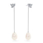 Delicate clusters of sparkling diamonds lead gracefully to matching freshwater pearl drops in the Livia design. With soft floral touches and a gentle sheen, these earrings beautifully blend radiant colour and timeless elegance.