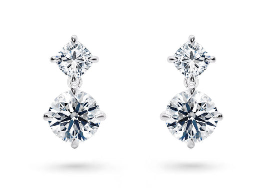 Your chosen diamonds hang gracefully from two compass-set studs, designed to capture the brilliance of the brightest stars in the night sky.