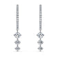 Dance among the stars with the Nova Drops — diamond-studded hoops adorned with three linked diamonds that shimmer with every move, creating a magical, celestial glow.